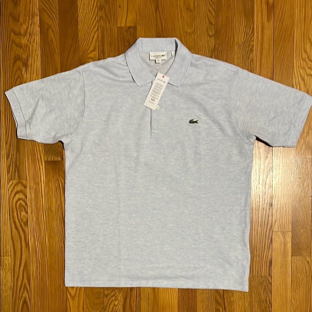 Lacoste Gray Polo Shirt Classic Piqué Design. This shirt has a light blue tint